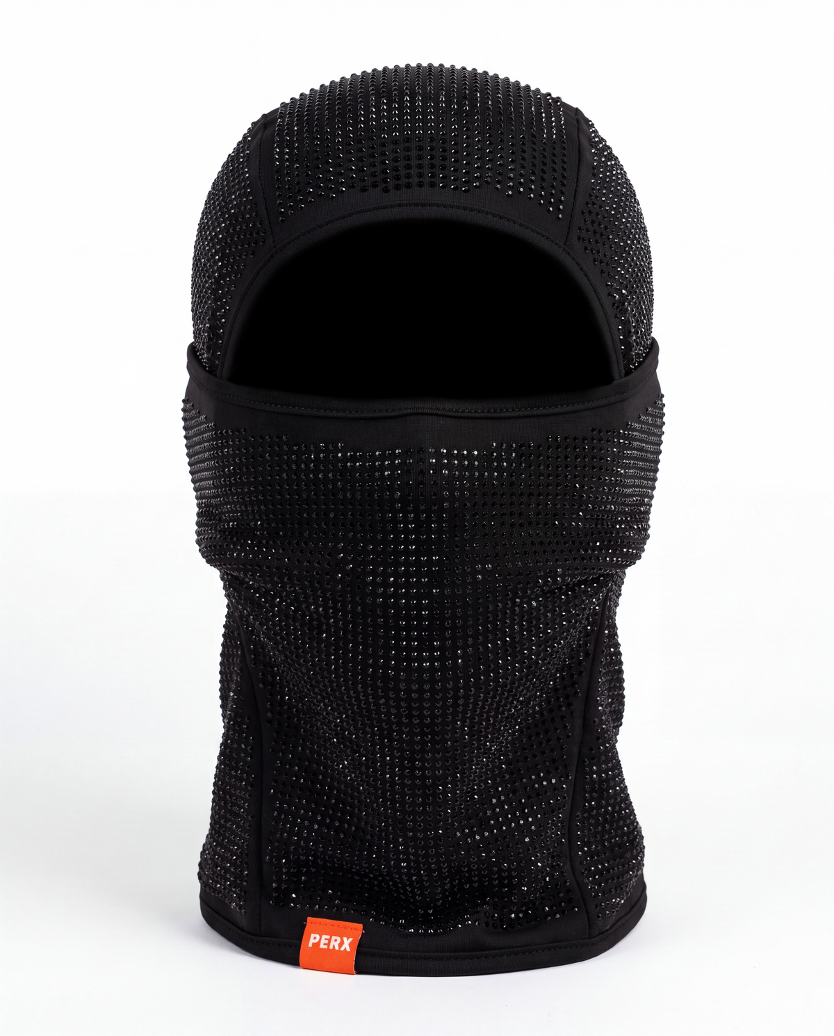 A black mesh balaclava face mask embellished with sparkling rhinestones, featuring a small orange brand tag that reads 'PERK' at the bottom, set against a plain white background.